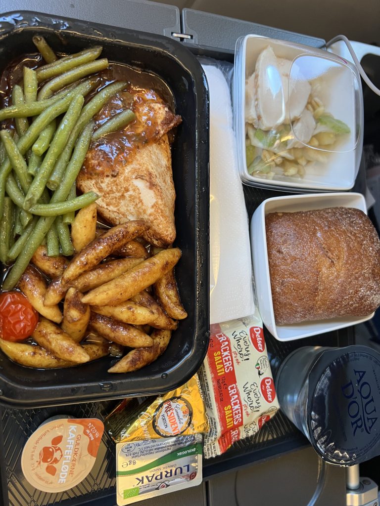 Food served on the aeroplane, chicken and potatoe