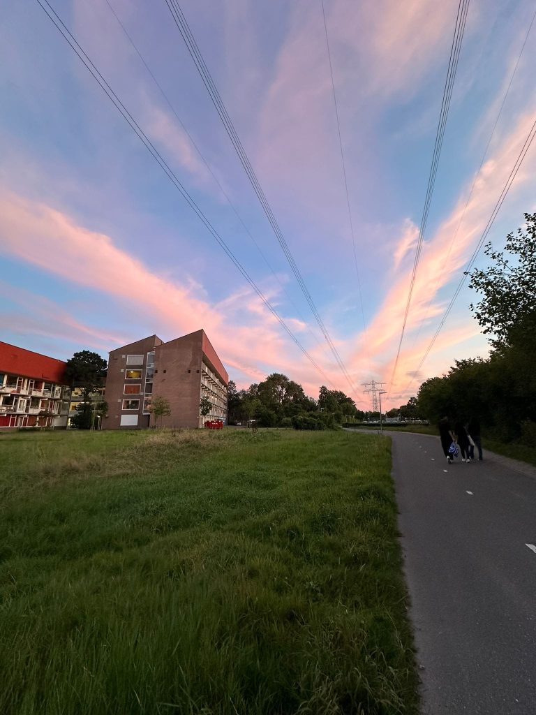 Photo of the sunset and the student dorms at Voorschoten