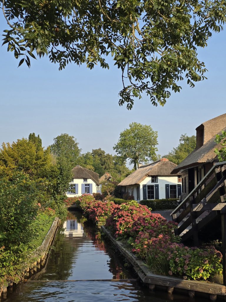 small canal in between cottages's gardens