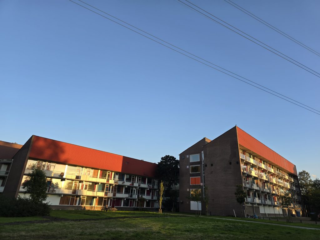 apartment complex under blue skies