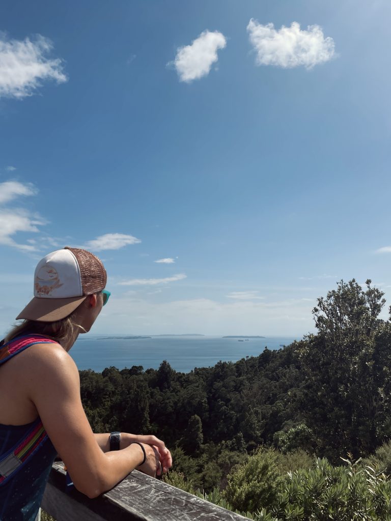 girl at the summit looking in the distance