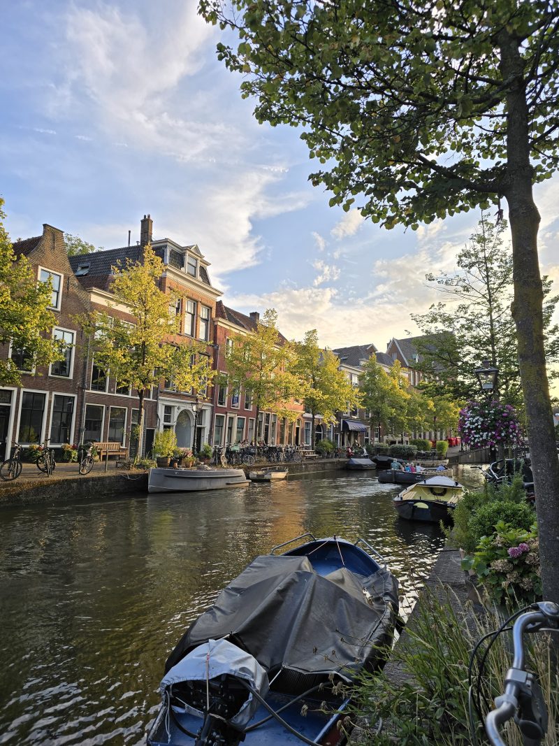 canal in Leiden city with boats docked on the side