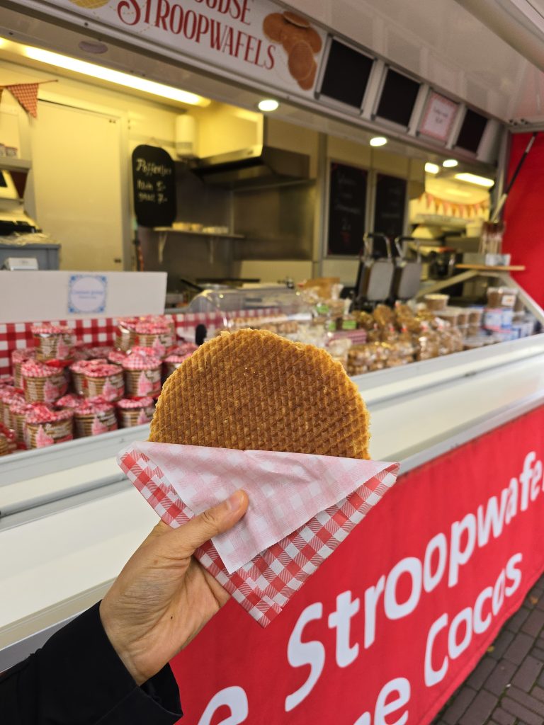 hand holding stroopwafel