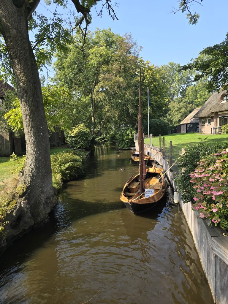 wooden boat on the canal for sale