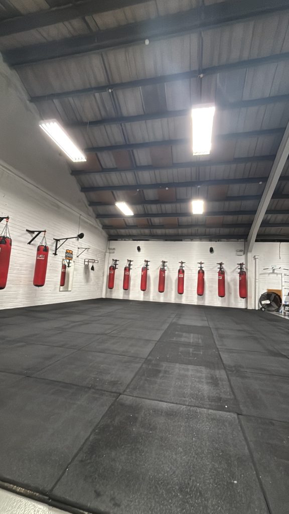 A massive boxing gym with over 15 bags