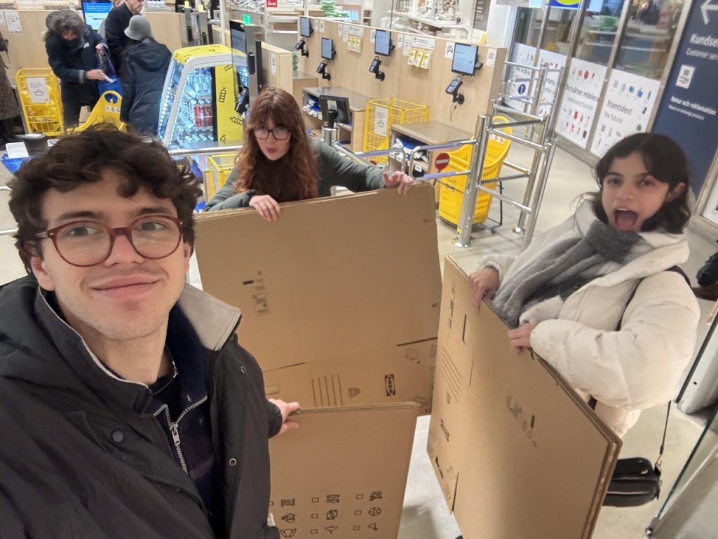 Three students buying packing boxes