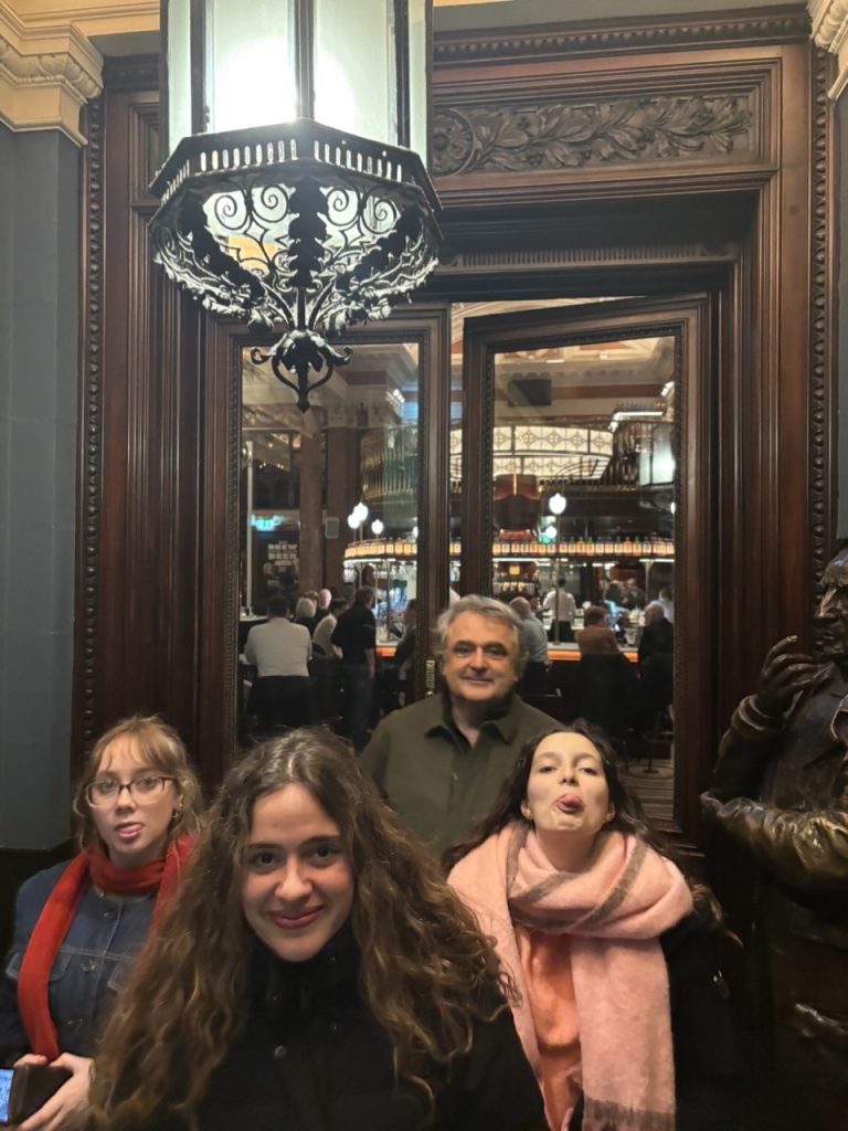 A group of students leaving a fancy-looking restaurant