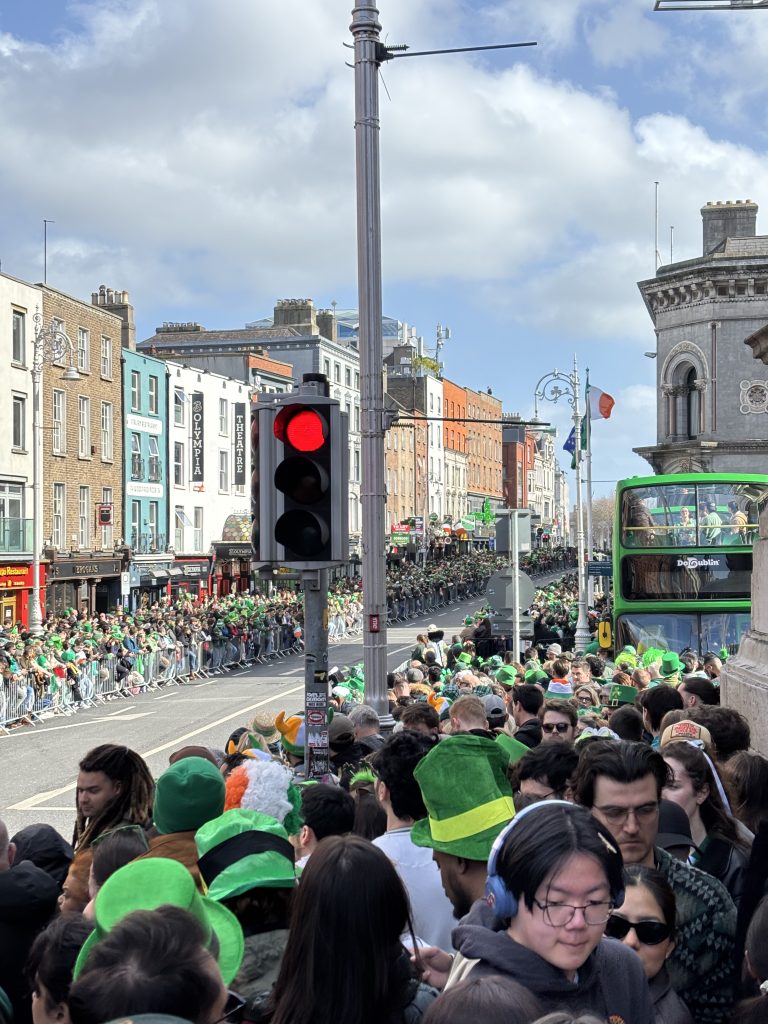 A huge crowd of people elbow-to-elbow on the street.