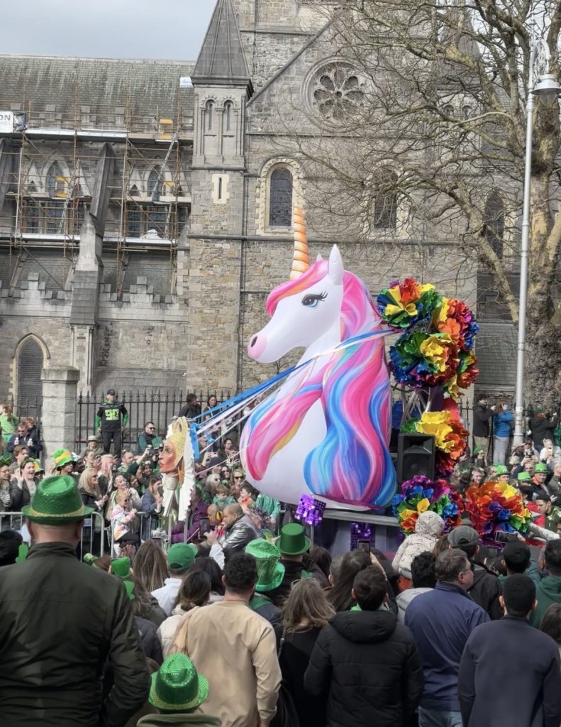 Huge unicorn float wth a head ornament at the front of it.
